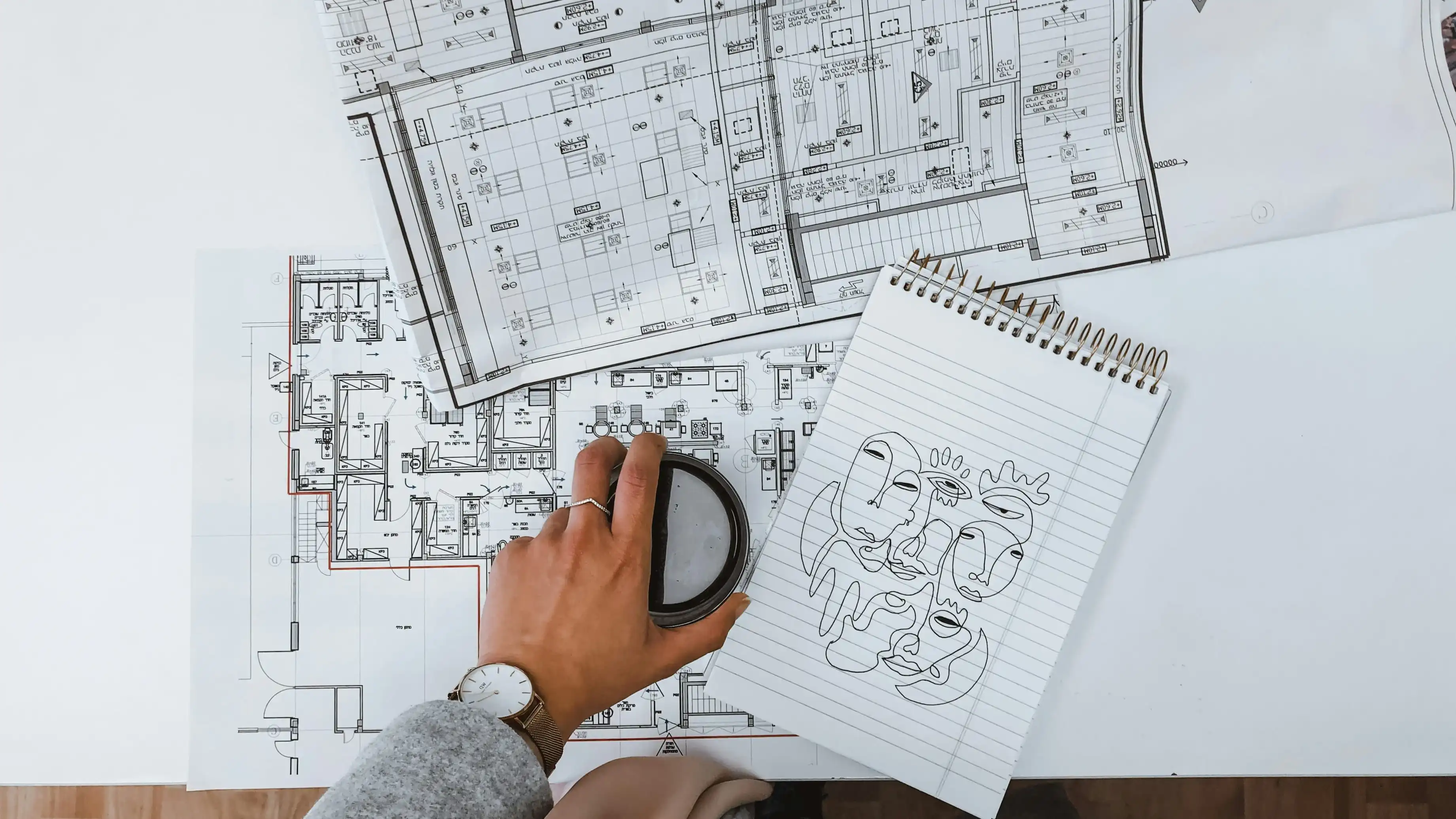 Construction project coordinator reviewing schedules and project documentation